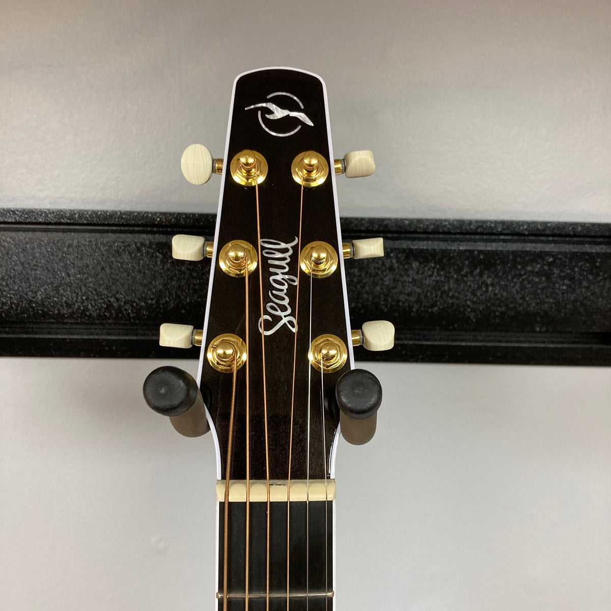 Seagull Artist Mosaic CW HG EQ guitar with high-gloss mahogany body, solid spruce top, cutaway, and LR Baggs Anthem system.