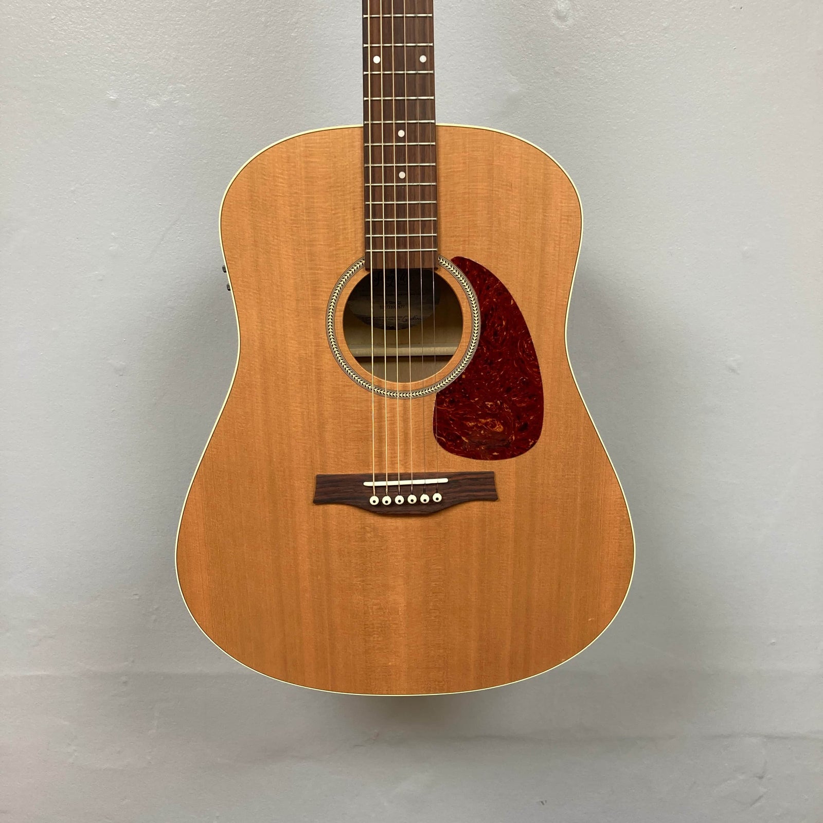 Seagull S6 QI Slim Acoustic Guitar w/Hard Case - USED/consign by Seagull, features a natural finish, six strings, dark red pickguard, and dot inlays; shown here on consignment and photographed against a light gray background.