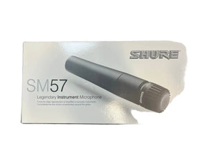 Shure SM57 microphone packaging on a textured surface