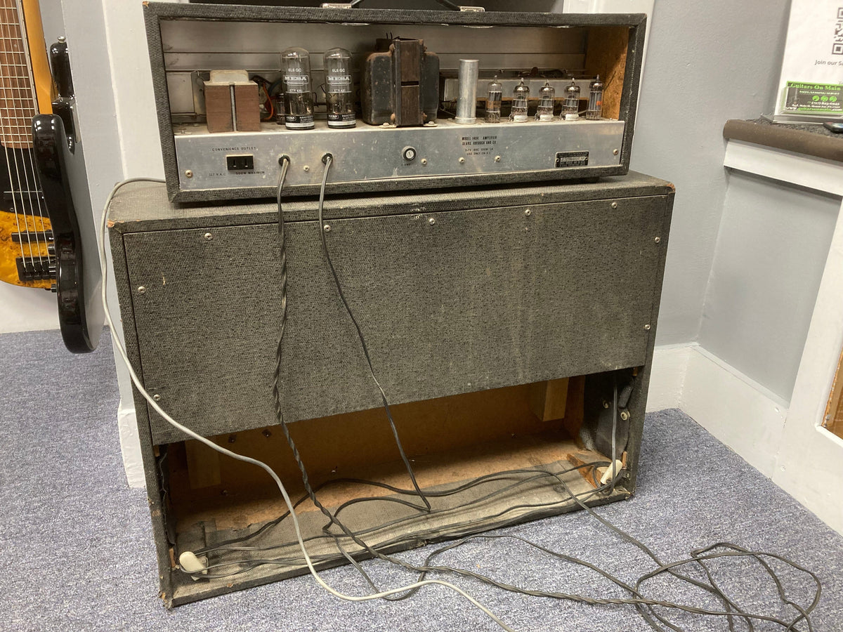 Vintage Silvertone Model 1484 Twin Twelve Guitar Amp with wires and original 2x12 cabinet, showcasing a storied 1960s design.