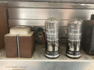 Silvertone Model 1484 Twin Twelve Guitar Amp 60s on a metal shelf with glass tubes, indicating recent servicing.