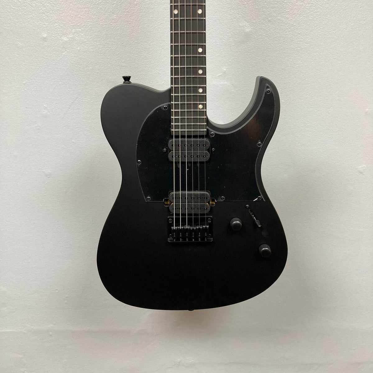 Spira T-400 MBK Electric Guitar - Black, featuring a single cutaway body, dual humbuckers, fixed bridge, and sleek design perfect for high-gain settings.