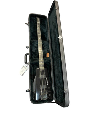 A 1984 Steinberger XL-2 Bass USA, featuring a headless design, is shown in an open hard case with a plush interior, highlighting this iconic vintage Steinberger instrument.