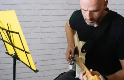 Student practicing guitar