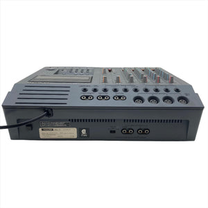 Tascam Portastudio 424 MKII Multi-Track Cassette Recorder, a grey audio mixer with buttons and knobs for hands-on analog recording and mixing.