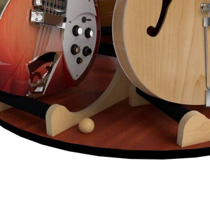 Two guitars rest on the A&S Crafted Products Carousel™ Deluxe Rotating Guitar Stand; one features a sunburst finish with chrome hardware, and the other displays a natural wood finish.