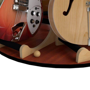 Close-up of two guitars on The Carousel™ Deluxe Rotating Guitar Stand | Combined Unit by A&S Crafted Products, highlighting their lower bodies and strings on a wooden surface.