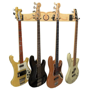 Four electric bass guitars in various colors hang on the A&S Crafted Products Pro-File™ Wall-Mounted Guitar Hanger, which features a decorative wooden mount with a musical inlay for stylish and artistic storage.