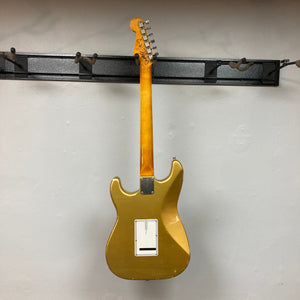 TopHat Stratavarius Aztec Gold Relic electric guitar on display, showcasing its aged finish, rosewood fretboard, and nickel hardware.