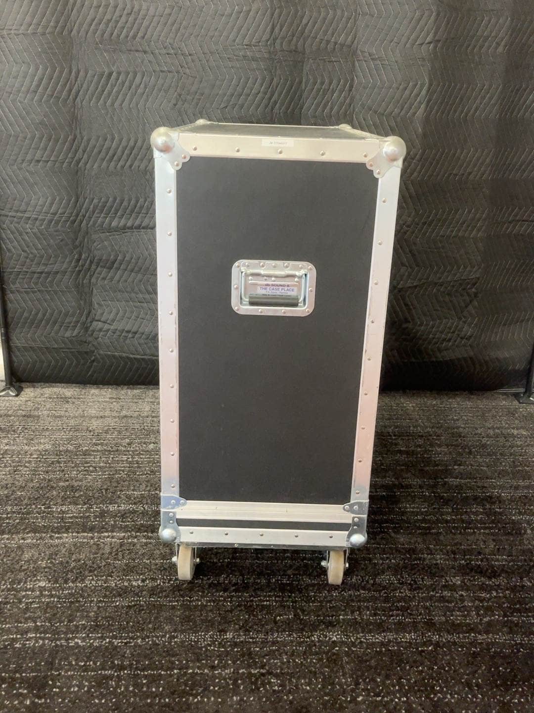 Side view of flight case showing handle and casters