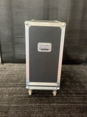 Side view of flight case showing handle and casters
