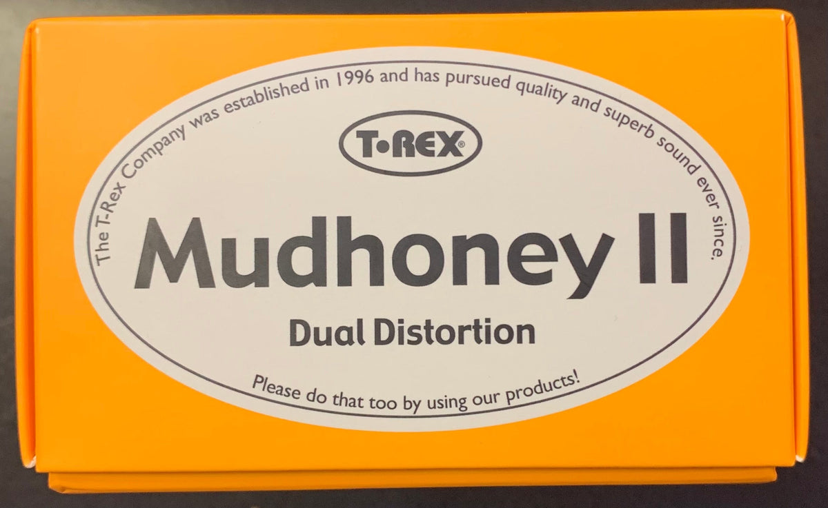 T-REX Mudhoney II Dual Distortion Pedal USED with two channels, tone controls, and boost functions, shown in original packaging with label.