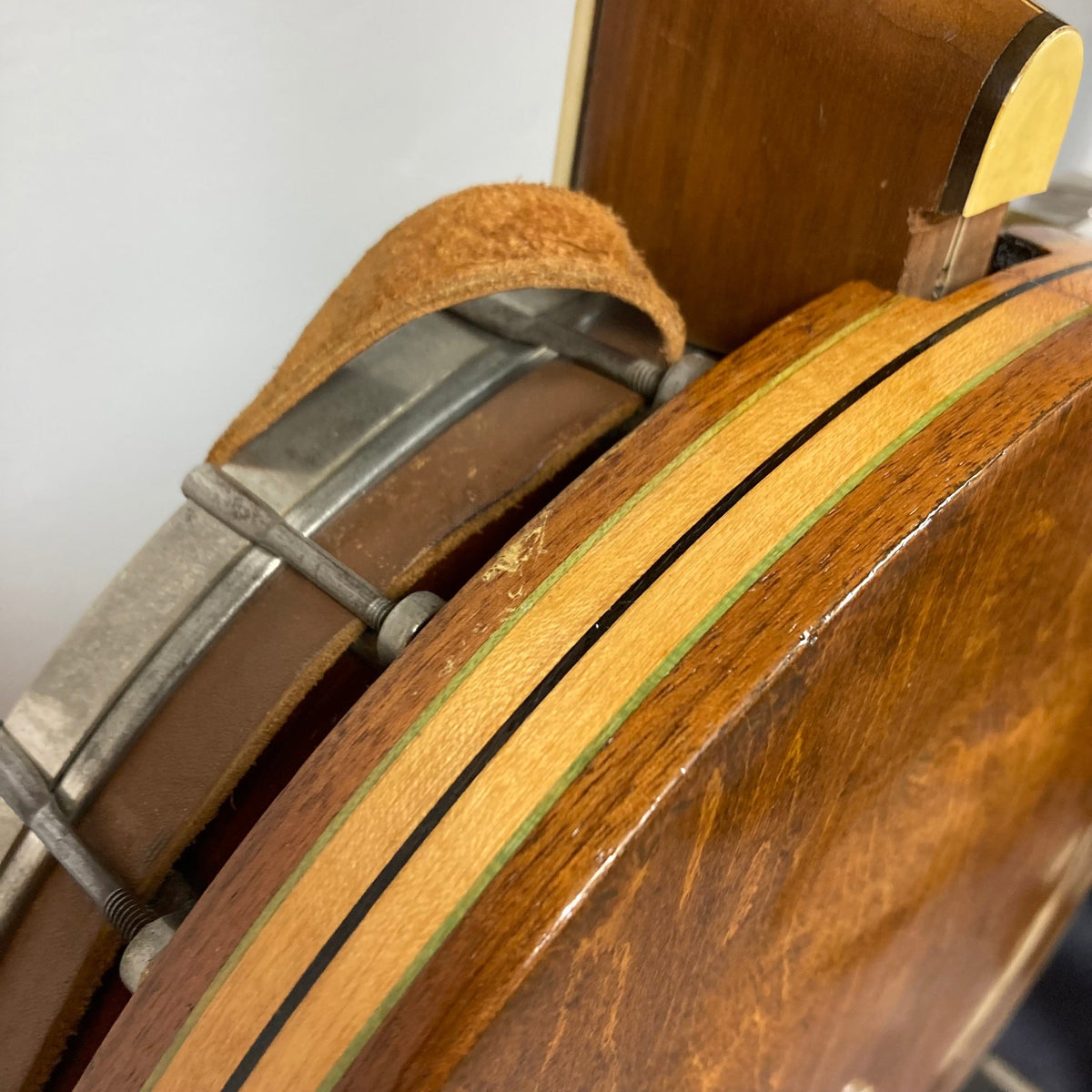 Close-up of the Vintage 1920-1930s Gretsch Broadkaster 4-String Tenor Banjo, highlighting its maple body, neck, and nickel-plated hardware.