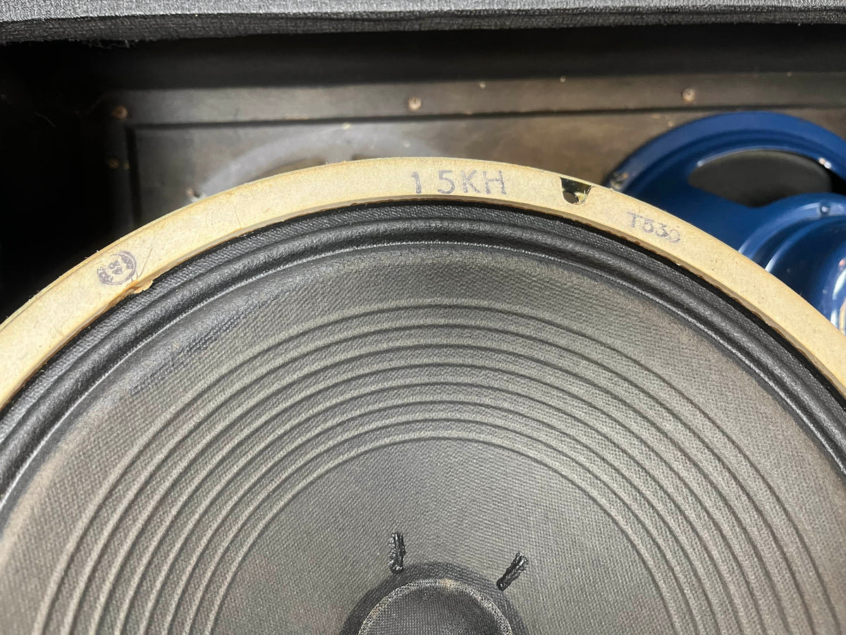 Close-up of a speaker cone from a Vintage 1963 Vox AC30/6 Normal, with "15KH" and "T536" marked on the edge; another Celestion Blue T530 speaker is partly visible in the background.