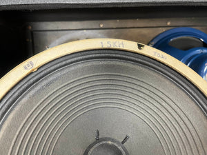 Close-up of a speaker cone from a Vintage 1963 Vox AC30/6 Normal, with "15KH" and "T536" marked on the edge; another Celestion Blue T530 speaker is partly visible in the background.