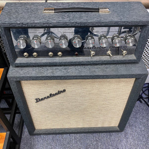 Vintage Danelectro DM-25 1960s Guitar Amp with knobs and dials, showcasing its retro design and tone-shaping controls.