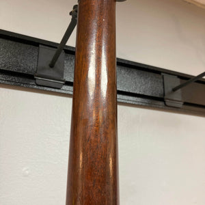 Close-up of the wooden neck on a Waterloo WL-12 Parlor Acoustic w/Case Used Consign guitar, showing its glossy finish. A white wall and black mounting bracket are in the background. Brand: Waterloo.