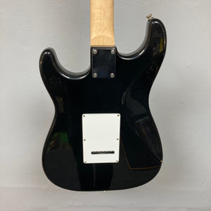 ZZ Top Signed Strat Style Guitar, black electric guitar with a white label, featuring signatures from Billy Gibbons, Dusty Hill, and Frank Beard.