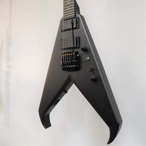 Dean Kerry King V Black Satin electric guitar with V-shaped body, ebony fingerboard, and EMG pickups, displayed on a wall.