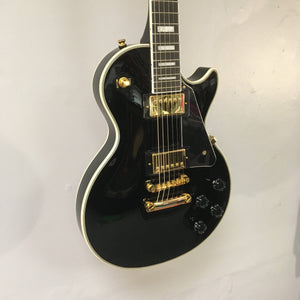 2022 Epiphone Les Paul Custom Ebony guitar with Gibson pickups, gold hardware, and a Tune-O-Matic bridge, showcased against a neutral backdrop.