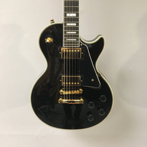 2022 Epiphone Les Paul Custom Ebony features gold hardware and white binding, equipped with Gibson pickups. Includes a Gator case for protection.