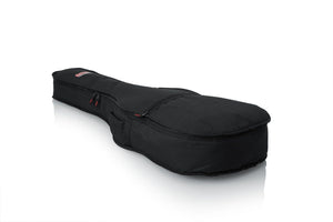 Gator Economy Gig Bag for Dreadnought Guitars with durable nylon exterior and heavy-duty zipper, featuring foam padding and an exterior pocket for accessories.