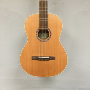 Godin Etude Classical Guitar, close-up of strings and body, showcasing craftsmanship and detailed construction.