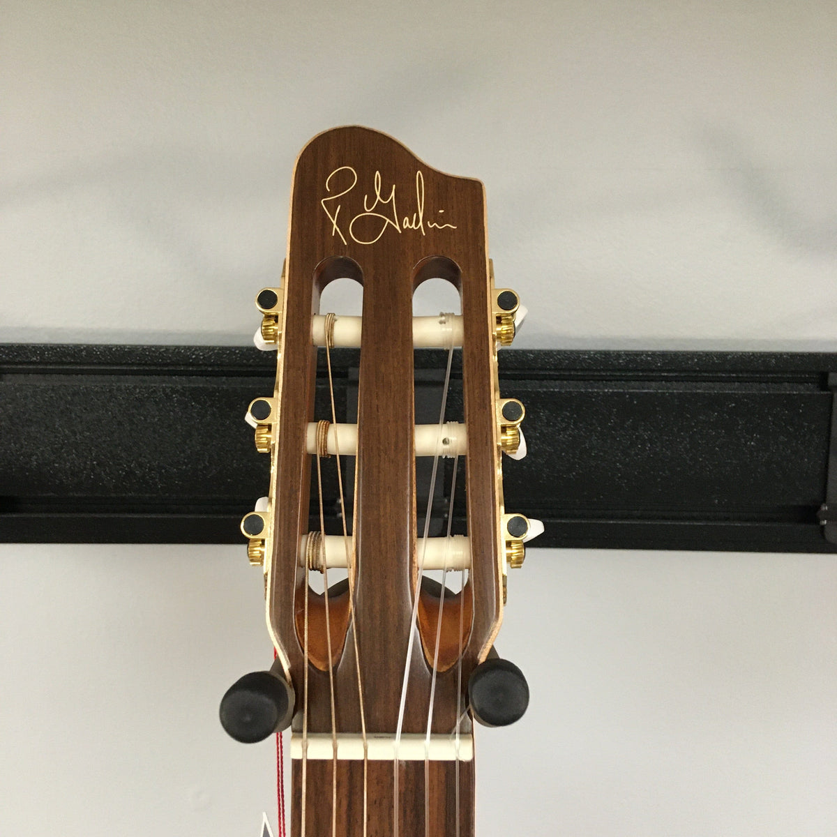 Close-up of the Godin Etude Classical Guitar, featuring a solid cedar top and rosewood fingerboard, showcasing its detailed craftsmanship and high-quality finish.