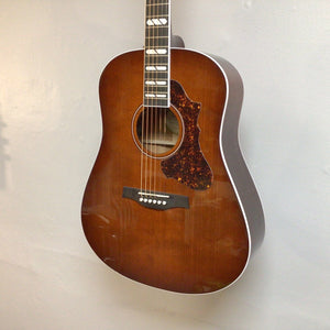 Godin Metropolis LTD Havana Burst HG EQ SF guitar, close-up showing strings and body detail, highlighting a small finish blemish near the sound hole.