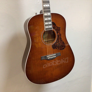 Godin Metropolis LTD Havana Burst HG EQ SF acoustic guitar with a small blemish near the sound hole, featuring detailed craftsmanship and rich tones.