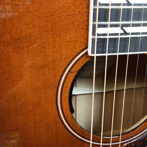 Close-up of Godin Metropolis LTD Havana Burst HG EQ SF guitar strings near sound hole, highlighting its premium build and finish.