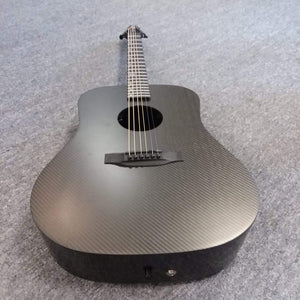 Klos Full Carbon Deluxe Acoustic Electric Guitar on grey carpet, close-up of strings and body, showcasing durable carbon fiber construction.