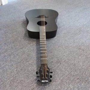 Klos Full Carbon Deluxe Acoustic Electric Guitar lying on a carpet, showcasing its durable carbon fiber body and neck.