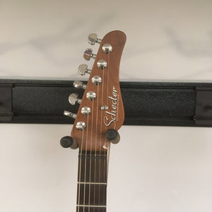 Schecter Nick Johnston Traditional Atomic Frost Electric Guitar headstock close-up showing tuning pegs and part of the neck.