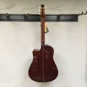 Seagull Artist Peppino Signature Acoustic Guitar on display, showcasing its solid spruce top and mahogany body, ideal for finger pickers and alternate tunings.