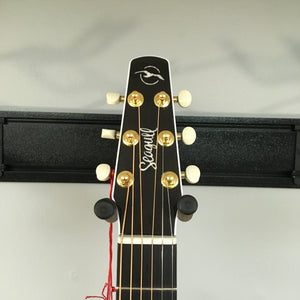 Seagull Artist Peppino Signature Acoustic Guitar headstock showing knobs and strings, emphasizing its bullet-shaped design for tuning stability.