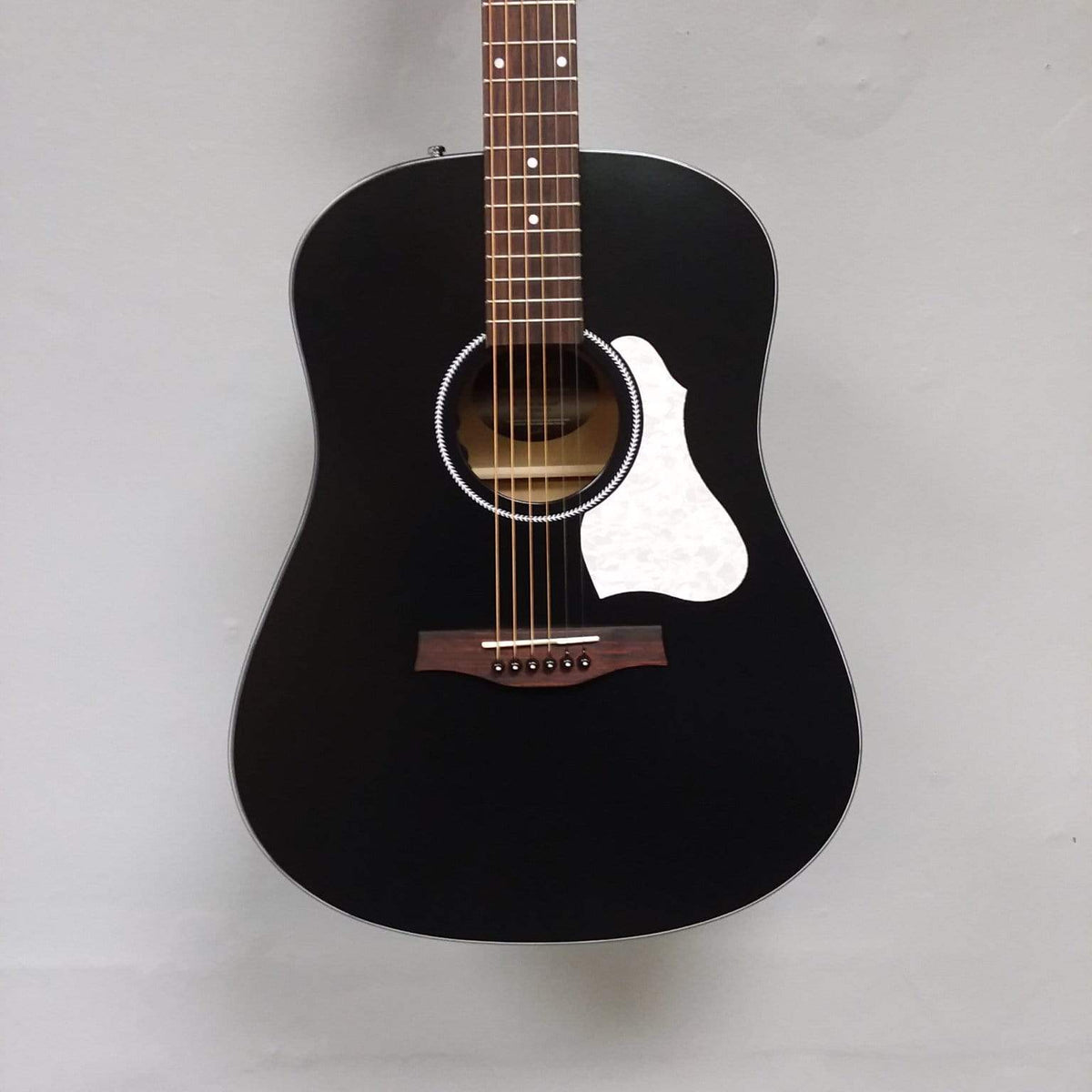 Seagull S6 Classic A/E Black guitar with semi-gloss finish, solid cedar top, and onboard Fishman Sonitone preamp.