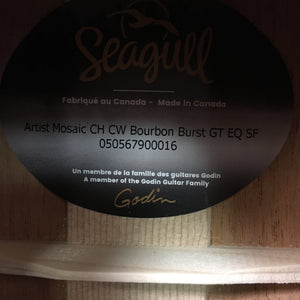 Seagull Artist Mosaic CH CW GT EQ Bourbon Burst guitar with black and gold label on wood surface.